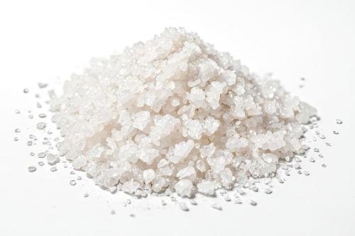 Close Up of Pile of White Sea Salt on White Background